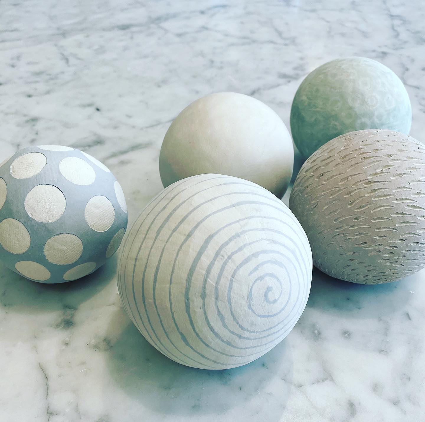 Textured ceramic spheres by Leaf Ceramics